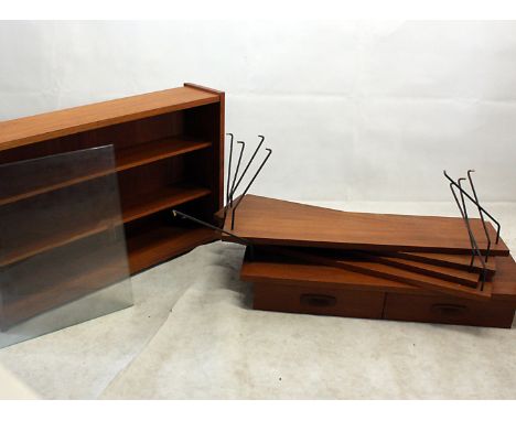 A 1960s ladder rack style shelving unit, comprising four long and two short uprights, a glazed display cabinet, a suspended d