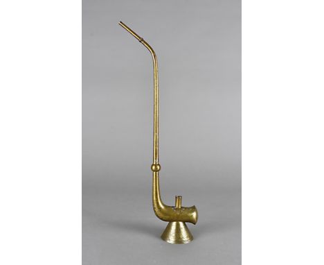 An early 20th Century lacquered brass opium pipe, with engraved figures and bats, signed to bowl, 46 cm high 