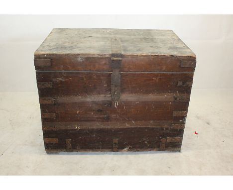 An early 20th century steel bound travelling trunk, in tin interior, 76 cm wide x 51 cm deep x 60 cm high 