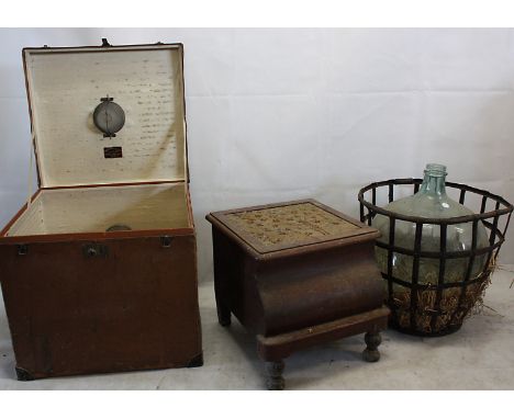 An Edwardian travel case by D H Evans, of square form, with interesting interior supports, together with a carboy, and a Vict