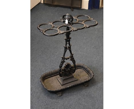 A Victorian cast iron stick stand, with eight sectional top, decorative stem and leaf moulded drip tray, 44 cm wide x 23 cm d