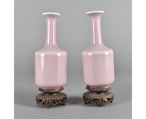 A pair of late 18th early 19th century monochrome Chinese porcelain vases, bottle shaped with light pink ground, with six cha