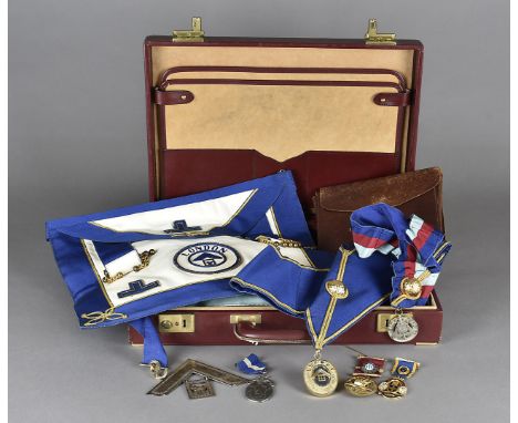 A collection of Masonic Regalia, to include aprons, sashes, jewels and books, mainly from the St Erkenwald Lodge, 1960s, a Fe
