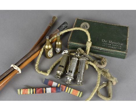 A Royal Army Service Corps swagger stick, together with a Repton Q.T.C example, plus another, a Royal Engineers cap badge, th