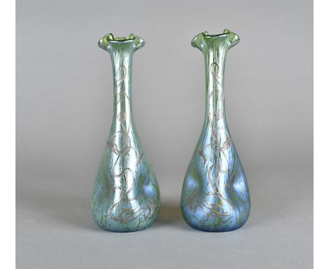 A pair of Art Nouveau glass iridescent and white metal overlaid vases, the ovoid pinched bodies with tapered necks and trefoi