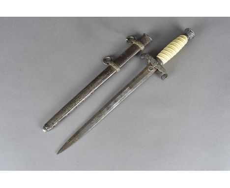 A WWII German Officer's dagger, unmarked to the blade, with eagle and swastika cross guard, with scabbard possibly reproducti