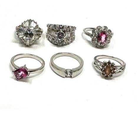 6 silver stone set rings 