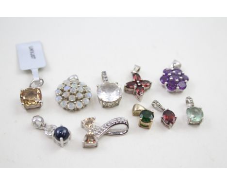 A collection of silver TGGC gemstone pendants including Opal (21g) 