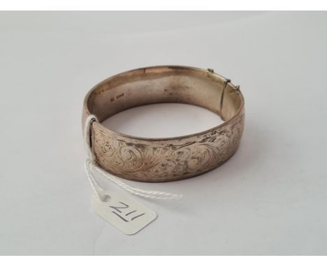 A hinged silver bangle - 45gms