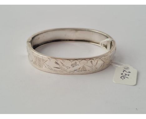 A silver Aesthetic bangle 