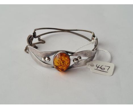 A vintage silver fancy amber bangle 