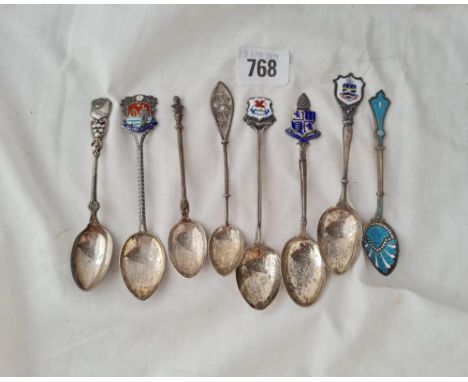 A group of 8 enamel decorated spoons 95 gms 