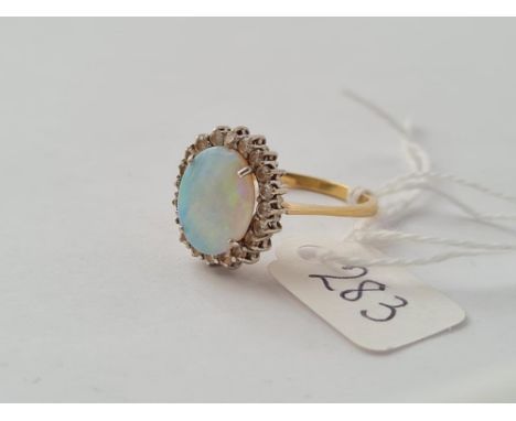 AN IMPRESSIVE OVAL OPAL &amp; DIAMOND CLUSTER RING IN 18CT GOLD - size S - 5.1gms