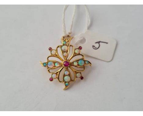 An attractive opal starburst brooch/pendant with central small ruby set in gol120d- 5.1gms