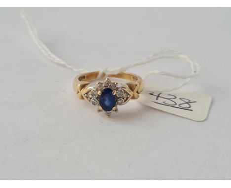 A sapphire &amp; diamond ring in 9ct - size K - 3.4gms