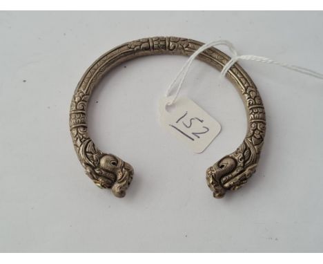 An unusual metal oriental dragon bangle set with turquoise 