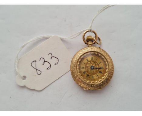 A pretty ladies gold fob watch with enamel floral decoration to back in 9ct - 20.5gms