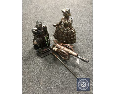 Two Art Deco fire companions, knight and lady, and a cannon fireplace stand with poker 