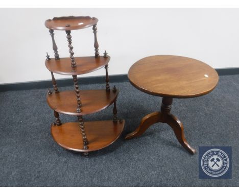 An oval mahogany pedestal occasional table together with a mahogany D-shaped four tier what-not stand 