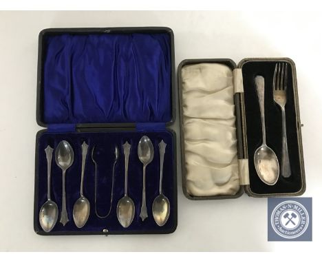 A set of six cased sterling silver teaspoons with sugar tongs and a cased silver fork and spoon 