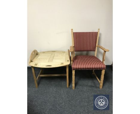 A blonde oak carver armchair together with a blonde oak butler's tray on stand 
