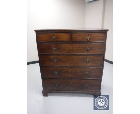 A late George III mahogany six drawer chest on bracket feet 