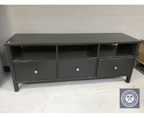 An Ikea entertainment stand fitted with three drawers 