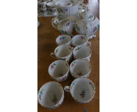 A late 19th Century English floral and gilt decorated part tea service, indistinctly marked.