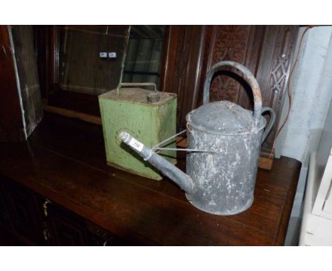 A Vintage Shell Mex fuel can and a Vintage galvanised watering can. (2)