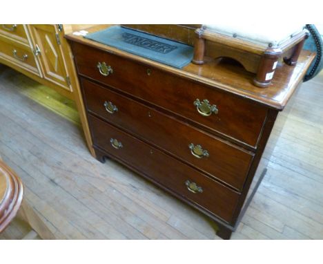A Georgian mahogany three drawer chest on bracket feet 