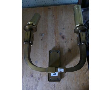 A brass Art Deco style two light wall sconce.