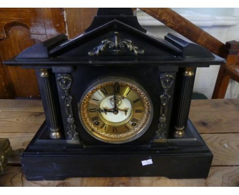  A late Victorian slate mantel clock in architectural type case