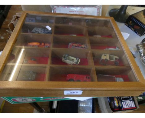 A mixed lot comprising a small glazed cabinet containing model vehicles, various collectors coin sets, albums, tea cards, hip