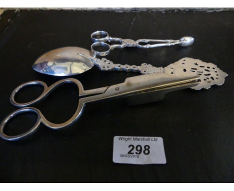 A mixed lot comprising 18th Century silver sugar nips with indistinct marks, a continental white metal spoon with pierced ste