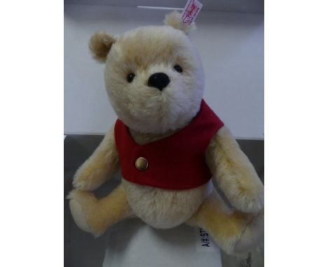 A modern Steiff 'Winnie the Pooh' bear with box and honey jar.