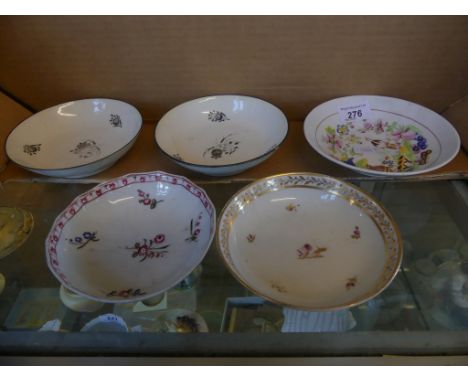 A collection of five 18th/early 19th Century English saucers decorated with a variety of floral designs.