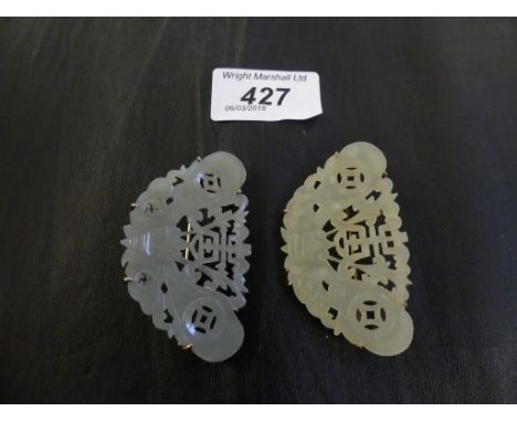 A pair of Chinese mutton jade brooches