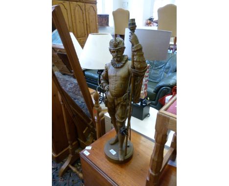 An unusual spelter table lamp, formed a cavalier 