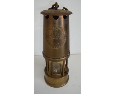 Large brass miner style lamp with swing loop handle (32cm high) with makers plaque, protector lamp and lightening type 6 M an