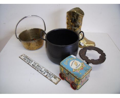 Small brass jam pan, a brass cowboy style boot, a iron cooking pot, Gypsy Rose tin and enamel 'Licence to sell Tobacco' sign 