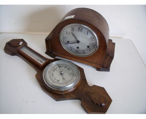 1920s oak cased steel faced chiming mantel clock and an oak mounted wall barometer (2) 