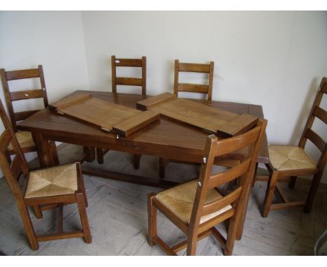 Quality modern oak rectangular extending dining table and a set of six ladder back dining chairs with drop-in rush seats 