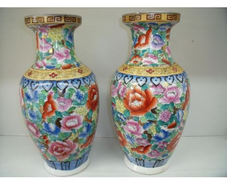 Pair of Chinese ceramic vases with floral detail (height 36.5cm) 