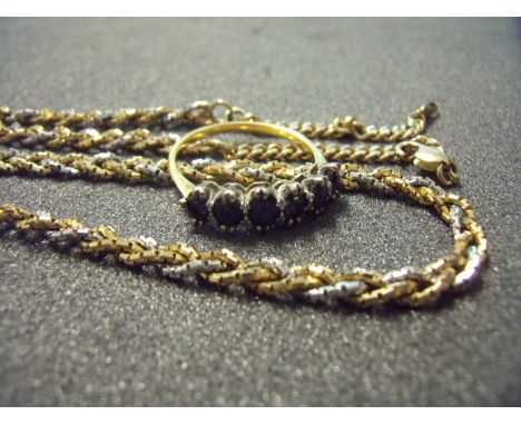 Two strand white and yellow gold necklace and a 18ct gold six stone sapphire ring (size P) (2) 