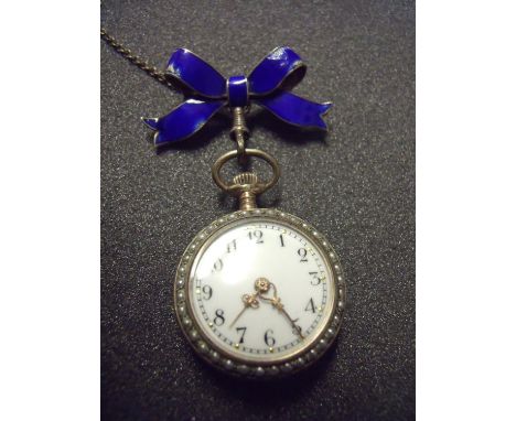 Early 20th C ladies silver and enamel fob watch with blue enamel brooch hanging pendant, the watch back with blue & gilt enam