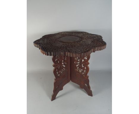 A Carved Colonial Tripod Table.