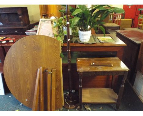 An Oak Side Table for Restoration, Circular Drop Leaf Kitchen Table, Oak Standard Lamp, Two Pot Plants and A Tray.