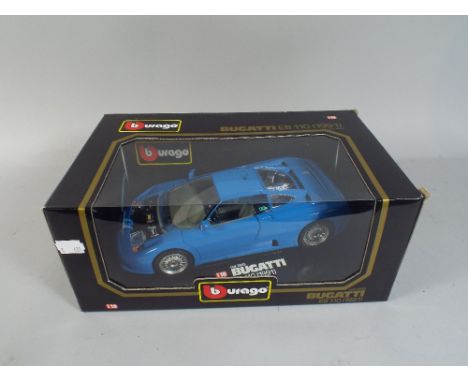 A Boxed Burago Bugatti Sports Car.