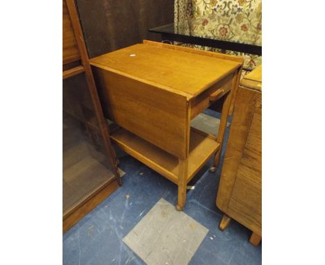 A Light Oak Drop Leaf Trolley with Single Drawer.