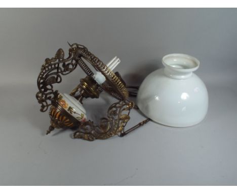 A Continental Ceramic and Pierced Brass Ceiling Light with Opaque Glass Shade.  